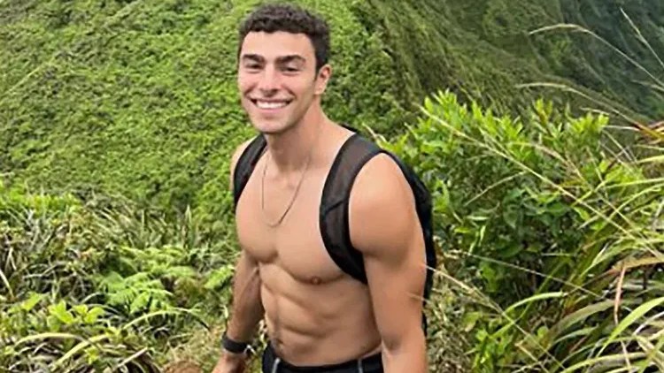 Luigi Mangione, shirtless in nature, former Ivy League student with back pain and brain fog. The killer of UHC's CEO